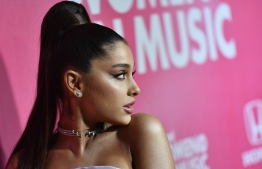 (FILES) In this file photo taken on December 06, 2018, US singer Ariana Grande attends Billboard's 13th Annual Women In Music event at Pier 36 in New York City. - Ariana Grande announced on December 21, 2020 she is engaged in a series of photos of her and her fiance, Dalton Gomez, a luxury real estate agent, and her engagement ring. (Photo by Angela Weiss / AFP)