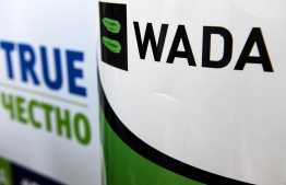 (FILES) In this file photograph taken on February 9, 2020, The World Anti-Doping Agency or WADA logo is seen at the Russkaya Zima (Russian Winter) Athletics competition in Moscow. - Starting November 2, 2020, before the Court of Arbitration for Sport (CAS) in Switzerland, Russia will contest its ban from major competitions decreed for four years by the World Anti-Doping Agency (WADA), the epilogue of an incredible confrontation with the scent of the Cold War. (Photo by Kirill KUDRYAVTSEV / AFP)