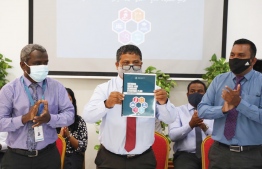 Minister of Environment Dr Hussain Rasheed Hassan (C) unveils the Water and Seweage National Strategic Action Plan (2020-2025). PHOTO: MINISTRY OF ENVIRONMENT