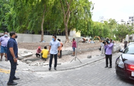 Vice President Faisal Naseem (C) observing the ongoing construction of the bus stand under development by the State Trading Organization at the Western coast of capital Male'. PHOTO: PRESIDENT'S OFFICE