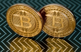 (FILES) In this file photo illustration taken on June 17, 2014 in Washington, DC shows bitcoin medals. - The US has seized more than $1 billion worth of bitcoin connected to the Silk Road criminal syndicate, the Justice Department announced on November 5, 2020. (Photo by KAREN BLEIER / AFP)