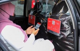 Transport Minister Aishath Nahula launches BML's new cashless payment solution for taxis. PHOTO/BML
