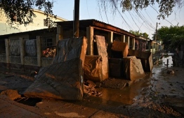 Mattresses and furniture covered in mud are seen in Planeta, municipality of La Lima, in the Honduran department of Cortes, on November 9, 2020, after the passage of Hurricane Eta, now downgraded to Tropical Storm. - Tropical Storm Eta made landfall at the Florida Keys late Sunday, bringing heavy rains and strong winds after slamming Cuba and earlier cutting a deadly path through Central America and southern Mexico. At least 200 people are dead or missing after Eta -- initially classified as a hurricane -- ripped through Nicaragua, Guatemala, and Honduras, causing flooding and landslides. (Photo by Orlando SIERRA / AFP)