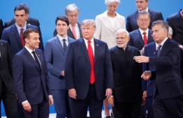 World leaders, including Canadian Prime Minister Justin Trudeau and U.S. President Donald Trump, centre, get ready for a summit family photo at the G20 leaders' summit in Buenos Aires in 2018. PHOTO: PABLO MARTINEZ MONSIVAIS / AP