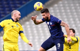 France's forward Olivier Giroud heads the ball during the UEFA Nations League A group 3 football match between France and Sweden at the Stade de France in Saint-Denis, north of Paris, on November 17, 2020. (Photo by FRANCK FIFE / AFP)