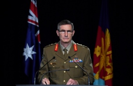 Chief of the Australian Defence Force (ADF) General Angus Campbell delivers the findings from the Inspector-General of the Australian Defence Force Afghanistan Inquiry, in Canberra on November 19, 2020. (Photo by Mick Tasikas / POOL / AFP)
