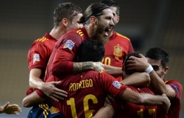 Spain's midfielder Rodrigo Hernandez celebrates his goal with teammates during the UEFA Nations League footbal match between Spain and Germany at La Cartuja stadium in Seville on November 17, 2020. (Photo by CRISTINA QUICLER / AFP)