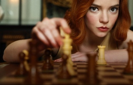 The Queen's Gambit is an American coming-of-age period drama miniseries based on Walter Tevis's 1983 novel of the same name, created for Netflix by Scott Frank and Allan Scott[1][2] and written and directed by the former. Beginning mid-1950s and proceeding into the 1960s, the story is about an orphaned chess prodigy on her rise to becoming the world's greatest chess player while struggling with emotional problems and drug and alcohol dependency. PHOTO: NETFLIX