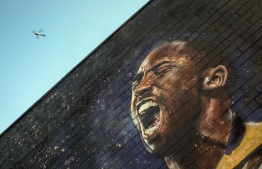 -- AFP PICTURES OF THE YEAR 2020 --

A helicopter flies over a Kobe Bryant mural in downtown Los Angeles on January 26, 2020. - Nine people were killed in the helicopter crash which claimed the life of NBA star Kobe Bryant and his 13 year old daughter, Los Angeles officials confirmed on Sunday. Los Angeles County Sheriff Alex Villanueva said eight passengers and the pilot of the aircraft died in the accident. The helicopter crashed in foggy weather in the Los Angeles suburb of Calabasas. Authorities said firefighters received a call shortly at 9:47 am about the crash, which caused a brush fire on a hillside. (Photo by Apu GOMES / AFP)