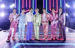 In this handout image courtesy of ABC South Korean band BTS performs during the 2020 American Music Awards aired from the Microsoft theatre on November 22, 2020 in Los Angeles. (Photo by - / American Broadcasting Companies, Inc. / ABC / AFP) / 