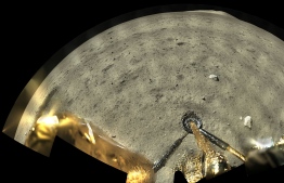 This picture taken on December 1, 2020 and released on December 2, 2020 by the China National Space Administration (CNSA) via CNS shows an image of the moon surface taken by the panoramic camera aboard the lander-ascender combination of the Chang'e-5 spacecraft after landing on the moon. - An unmanned Chinese spacecraft landed on the Moon on December 1, state media reported, the latest milestone in a mission to collect samples from the lunar surface. (Photo by - / China National Space Administration (CNSA) via CNS / AFP) / 