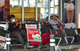 Tourists waiting in Velana International Airport: to curb the spread of COVID-19 within Maldives, HPA strengthens restrictive measures -- Photo: Ahmed Awshan Ilyas/ Mihaaru