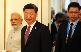 Last year, India and China,  the world’s largest and fourth largest emitters, said the onus remained on the countries historically responsible for climate change to move money. In 2020, both countries shifted rhetoric, making multiple pledges to meet climate goals but experts say, these words are still far from what is required. In this photo, India prime minister Narendra Modi (left) is seen next to China president Xi Jinping. PHOTO: RUSSIAN PRESIDENT'S OFFICE