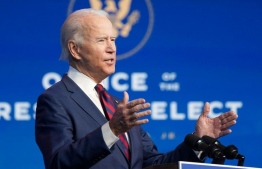 US President-elect Joe Biden speaks during an event to introduce key Cabinet nominees and members of his climate team at The Queen Theater in Wilmington, Delaware on December 19, 2020.  ALEX EDELMAN / AFP