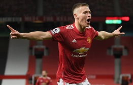 Manchester United's Scottish midfielder Scott McTominay celebrates scoring his team's second goal during the English Premier League football match between Manchester United and Leeds United at Old Trafford in Manchester, north west England, on December 20, 2020. (Photo by Michael Regan / POOL / AFP) / RESTRICTED TO EDITORIAL USE. No use with unauthorized audio, video, data, fixture lists, club/league logos or 'live' services. Online in-match use limited to 120 images. An additional 40 images may be used in extra time. No video emulation. Social media in-match use limited to 120 images. An additional 40 images may be used in extra time. No use in betting publications, games or single club/league/player publications. / 