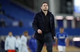 Chelsea's English head coach Frank Lampard walks off the pitch at the end of English Premier League football match between Everton and Chelsea at Goodison Park in Liverpool, north west England on December 12, 2020. - Everton won the game 1-0. (Photo by Clive Brunskill / POOL / AFP) / RESTRICTED TO EDITORIAL USE. No use with unauthorized audio, video, data, fixture lists, club/league logos or 'live' services. Online in-match use limited to 120 images. An additional 40 images may be used in extra time. No video emulation. Social media in-match use limited to 120 images. An additional 40 images may be used in extra time. No use in betting publications, games or single club/league/player publications. / 