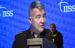 (FILES) In this file photo taken on November 23, 2019 General Kenneth F. McKenzie, Jr., US Central Command (CENTCOM) Commander, addresses a session focused on maritime security during 15th Manama Dialogue, a regional security summit organized by the International Institute for Strategic Studies (IISS), in the Bahraini capital Manama. - Washington is "prepared to react" if Tehran launches an attack to mark the first anniversary of the killing of powerful Iranian General Qasem Soleimani, the head of US forces in the Middle East warned on December 20. 2020. 
"We are prepared to defend ourselves, our friends and partners in the region, and we're prepared to react if necessary," General Kenneth McKenzie, who heads the US Central Command (Centcom), told journalists. (Photo by Mazen Mahdi / AFP)