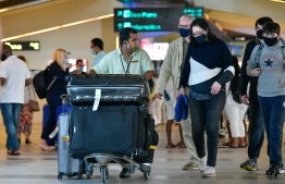 Resort representatives helping tourists in Velana International Airport: