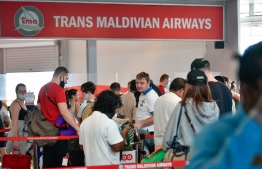 (FILE) Photo taken in December 21, 2020, shows tourists that arrived in Velana International Airport, near the Trans Maldivian Airways sign: unvaccinated tourists were not allowed in administrative islands previously -- Photo: Nishan Ali/ Mihaaru