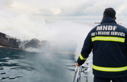 MNDF Fire and Rescue officer amid efforts to extinguish the fire in Thilafushi lagoon. PHOTO: MNDF