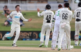 New Zealand’s Mitchell Santner (L) celebrates after taking the wicket of Pakistan’s Mohammad Abbas during the fifth day of the first cricket Test match between New Zealand and Pakistan at the Bay Oval in Mount Maunganui on December 30, 2020. PHOTO: MICHAEL BRADLEY / AFP