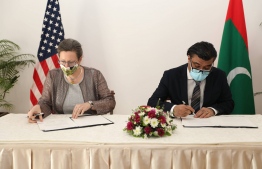 The Maldivian ambassador to Sri Lanka Omar Abdul Razzak and the US Ambassador to Maldives Alaina Teplitz signs a debt-relief agreement under the G-20 Debt Service Suspension Initiative (DSSI). PHOTO: TEPLITZ