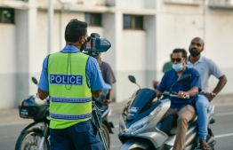 An officer of the Maldives Police Service's Traffic Division monitors the traffic-- Photo: Mihaaru