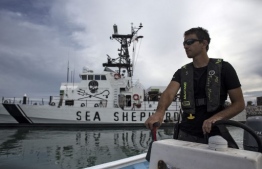 (FILES) In this file photo taken on March 7, 2018, M/V Farley Mowat crew member Tomas, pilots a boat at the port of San Felipe, in the Gulf of California, Baja California State, northwestern Mexico, as part of the Sea Shepherd Conservation Society's operation "Milagro IV" to save the critically endangered vaquita porpoise. - A Mexican fisherman has died after his vessel collided with a boat of the US conservation group Sea Shepherd in a sanctuary for the endangered vaquita porpoise, an official said on January 4, 2021. The fisherman was hospitalized on December 31 in the northwestern city of Mexicali with serious injuries including hip and pelvic fractures, regional health chief Alonso Perez told AFP. (Photo by GUILLERMO ARIAS / AFP)