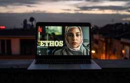A picture taken on December 24, 2020 in Istanbul shows a poster of "Ethos" (bir baskadir) Netflix series on a laptop's screen. - The psychological thriller "Ethos" ("Bir Baskadir") is Turkey's latest slick streaming export, adding to an expanding list of local productions to make it big abroad. But director Berkun Oya's eight-part series goes where no previous Turkish TV drama has dared, feeding a national conversation that was once confined to bohemian art houses screening intellectual films. (Photo by Ozan KOSE / AFP)
