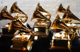 (FILES) In this file photo taken on January 28, 2018, Grammy trophies sit in the press room during the 60th Annual Grammy Awards in New York. - The Grammy awards celebrating music slated for January 31 in Los Angeles have been postponed due to Covid-19, which has been rapidly spreading in California, US media said on January 5, 2021. (Photo by Don EMMERT / AFP)