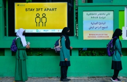 Students waiting in line according to HPA guidelines near the school gates at the beginning of the session. PHOTO: MIHAARU