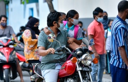 Parents dropping off their children to school during the Academic New Year of 2021. PHOTO: MIHAARU