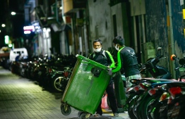 WAMCO employees collecting trash and garbage discarded from local residences; the authority's waste collection charges will be tied to STELCO's utility bill effective from June 2023-- Photo: Mihaaru