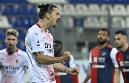 AC Milan's Swedish forward Zlatan Ibrahimovic celebrates after opening the scoring during the Italian Serie A football match Cagliari vs AC Milan on January 18, 2021 at the Sardegna Arena in Cagliari. (Photo by Alberto PIZZOLI / AFP)