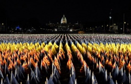 The "Field of Flags" is pictured on the National Mall as the US Capitol Building is prepared for the inauguration ceremonies for President-elect Joe Biden and Vice President-elect Kamala Harris on January 18, 2021 in Washington, DC. - President-elect Joe Biden and Vice President-elect Kamala Harris will be sworn into office January 20, 2021. (Photo by TIMOTHY A. CLARY / AFP)
