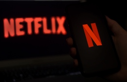 (FILES) In this file photo illustration a computer screen displays the Netflix logo on March 31, 2020 in Arlington, Virginia. (Photo by Olivier DOULIERY / AFP)