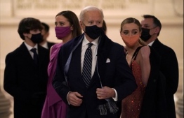 US President Joe Biden and family members attend the "Celebrating America" inaugural program at the Lincoln Memorial in Washington, DC, on January 20, 2021, after being sworn in at the US Capitol earlier in the day. (Photo by JOSHUA ROBERTS / POOL / AFP)