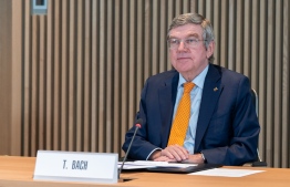 This handout picture taken and released on January 27, 2021 by the International Olympic Committee shows IOC president Thomas Bach attending an IOC Executive Board meeting on Tokyo Olympics in Lausanne. - With the coronavirus pandemic threatening the holding of the re-arranged Tokyo Olympics, IOC chief Thomas Bach is expected on January 27, 2021 to set out how a "safe" Games could be organised and respond to growing questions on vaccinating competitors. The International Olympic Committee said the day before, ahead of a meeting of its executive board, that it was determined the Tokyo Games will go ahead and that they would be "safe and secure". (Photo by Greg MARTIN / OIS/IOC / AFP) / RESTRICTED TO EDITORIAL USE - MANDATORY CREDIT "AFP PHOTO / IOC / GREG MARTIN " - NO MARKETING NO ADVERTISING CAMPAIGNS - DISTRIBUTED AS A SERVICE TO CLIENTS