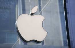 (FILES) In this file photo taken in center Milan on May 30, 2019 shows the logo of American multinational company Apple. - Apple said January 27 profits surged in the final three months of the year on growing sales of iPhones and services which lifted revenues to an all-time record.
Profit in the period ended December 26 rose 29 percent from a year ago to $28.7 billion, while revenues grew 21 percent to $111.4 billion, with international sales accounting for nearly two-thirds of sales. (Photo by Miguel MEDINA / AFP)