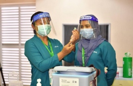 Health workers during the kick off of the vaccination programme in Maldives. PHOTO: MIHAARU