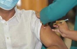 A frontline worker administering the COVID-19 vaccine. PHOTO: MIHAARU