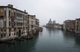 The Grand Canal is pictured from the Accademia bridge in Venice on February 7, 2021, as the carnival is being cancelled due to the Covid-19 pandemic. (Photo by Marco Bertorello / AFP)