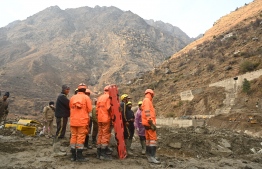 National Disaster Relief Force crew carry a stretcher near the destroyed Raini Bridge near Raini village of Chamoli district on February 10, 2021 after it was washed away by flash flood thought to have been caused when a after a glacier burst on February 7.
Sajjad HUSSAIN / AFP