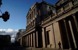 A jogger runs past the Bank of England (BoE) is pictured in the City of London on February 5, 2021. The Bank of England on Thursday projected Britain's economic recovery on the back of the nation's successful vaccines rollout, as it froze interest rates and stimulus.
Niklas HALLE'N / AFP
