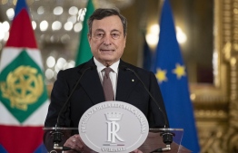 This photo taken and handout on February 12, 2021 by the Quirinale Palace Press Office shows Italy's new prime minister, former European Central Bank President Mario Draghi addressing the media on February 12, 2021 following a meeting with Italy's President at the Quirinale presidential palace in Rome. - The 73-year-old economist was expected to lead a new national unity government to replace Giuseppe Conte's centre-left coalition, which collapsed one month ago, leaving the country rudderless in an unprecedented crisis. (Photo by Handout / Quirinale Press Office / AFP) / 