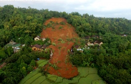 This aerial handout photo taken on February 15, 2021 and released by Indonesian National Board for Disaster Management (BNPB) shows the damages from a landslide in Nganjuk, East Java province, where at least two people died and 16 others are missing.
HANDOUT / Indonesian National Board for Disaster Management (BNPB) / AFP