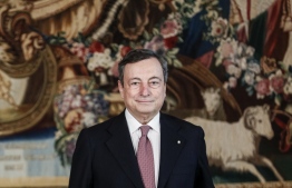 Italy's Prime Minister, Mario Draghi poses following a swearing-in ceremony at the Quirinale presidential palace in Rome on February 13, 2021. - Former European Central Bank chief Mario Draghi was formally appointed Italy's new prime minister on February 12, charged with guiding his country through the devastation wrought by the coronavirus pandemic. (Photo by GUGLIELMO MANGIAPANE / POOL / AFP)