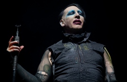 (FILES) In this file photo taken on November 08, 2019, Marilyn Manson performs during the Astroworld Festival at NRG Stadium in Houston, Texas - Los Angeles police are investigating domestic violence allegations against US goth rocker Marilyn Manson, the sheriff's department said on February 19, 2021. Confirmation of the probe comes after "Westworld" star Evan Rachel Wood this month accused Manson of years of abuse starting when she was a teenager. (Photo by SUZANNE CORDEIRO / AFP)