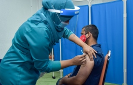 (FILES)  Immigrant worker getting the Covid-19 vaccine on February 25, 2021: the policy on medical checkups was changed after some immigrants in Maldives  was diagnosed for filariasis, a disease eradicated from Maldives -- Photo: Mihaaru