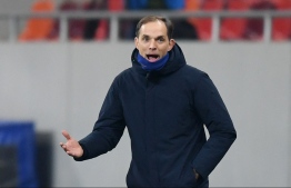 Chelsea's German head coach Thomas Tuchel gestures during the UEFA Champions League round of 16 first leg football match between Club Atletico de Madrid and Chelsea at the Arena Nationala stadium in Bucharest on February 23, 2021. (Photo by Daniel MIHAILESCU / AFP)